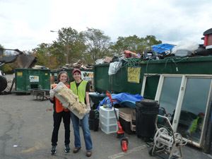 2 Women Holding Logs