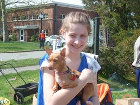 Girl Holding a Small Dog