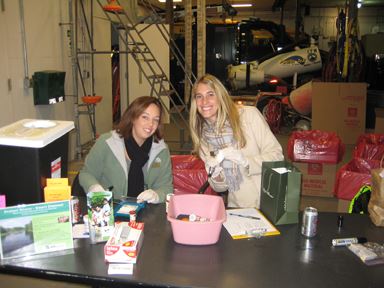 2 Women at a Check-In Table